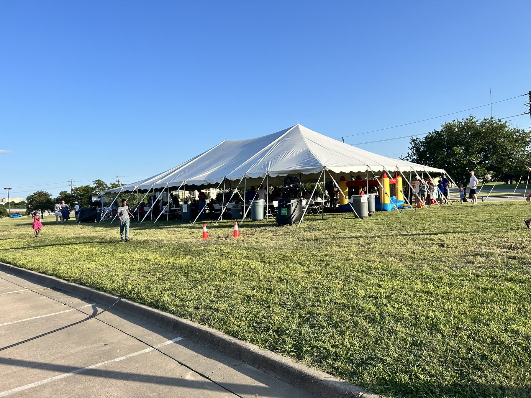 ECDR ministry tent with tables and chairs set up for Hillcrest Baptist Church.