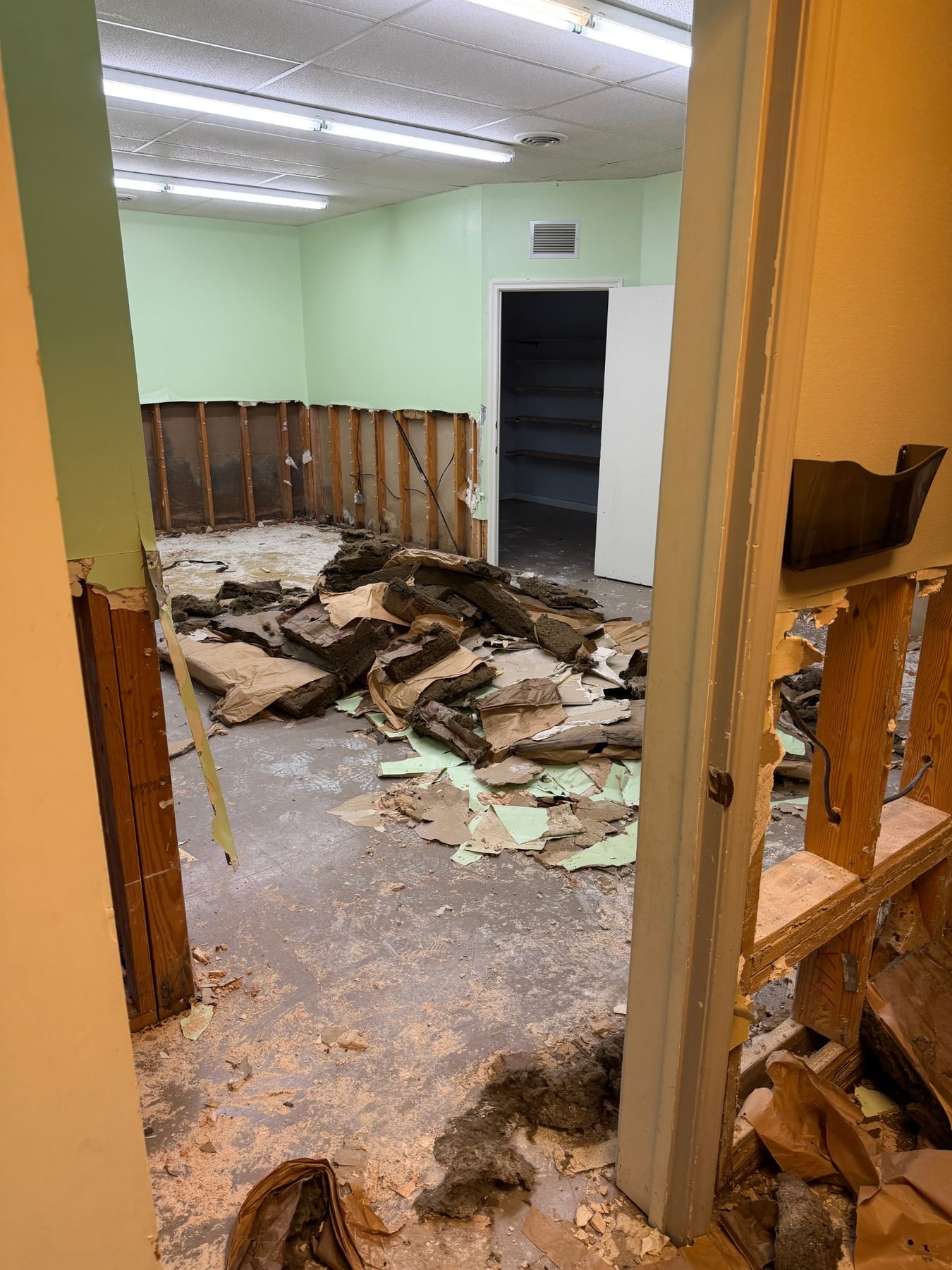 Flood-damaged wall materials and insulation removed from a Kerrville home during Fire and Flood recovery.