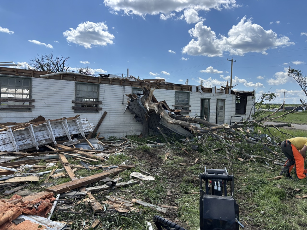 Storm debris and structural damage being cleared at the Mineral Wells Texans On Mission deployment.