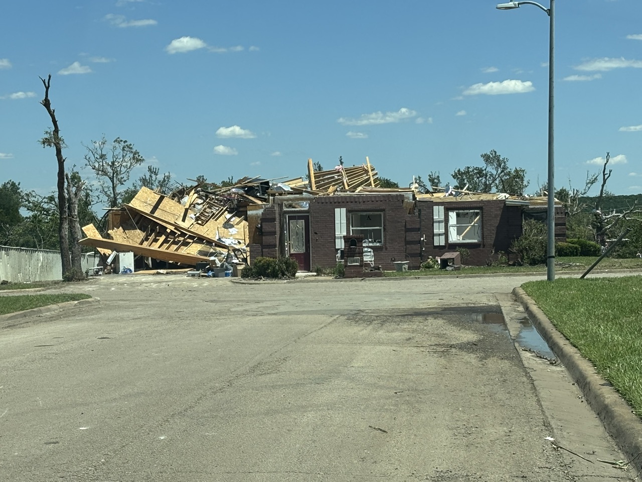 Volunteers and equipment clearing storm debris during the Mineral Wells deployment.